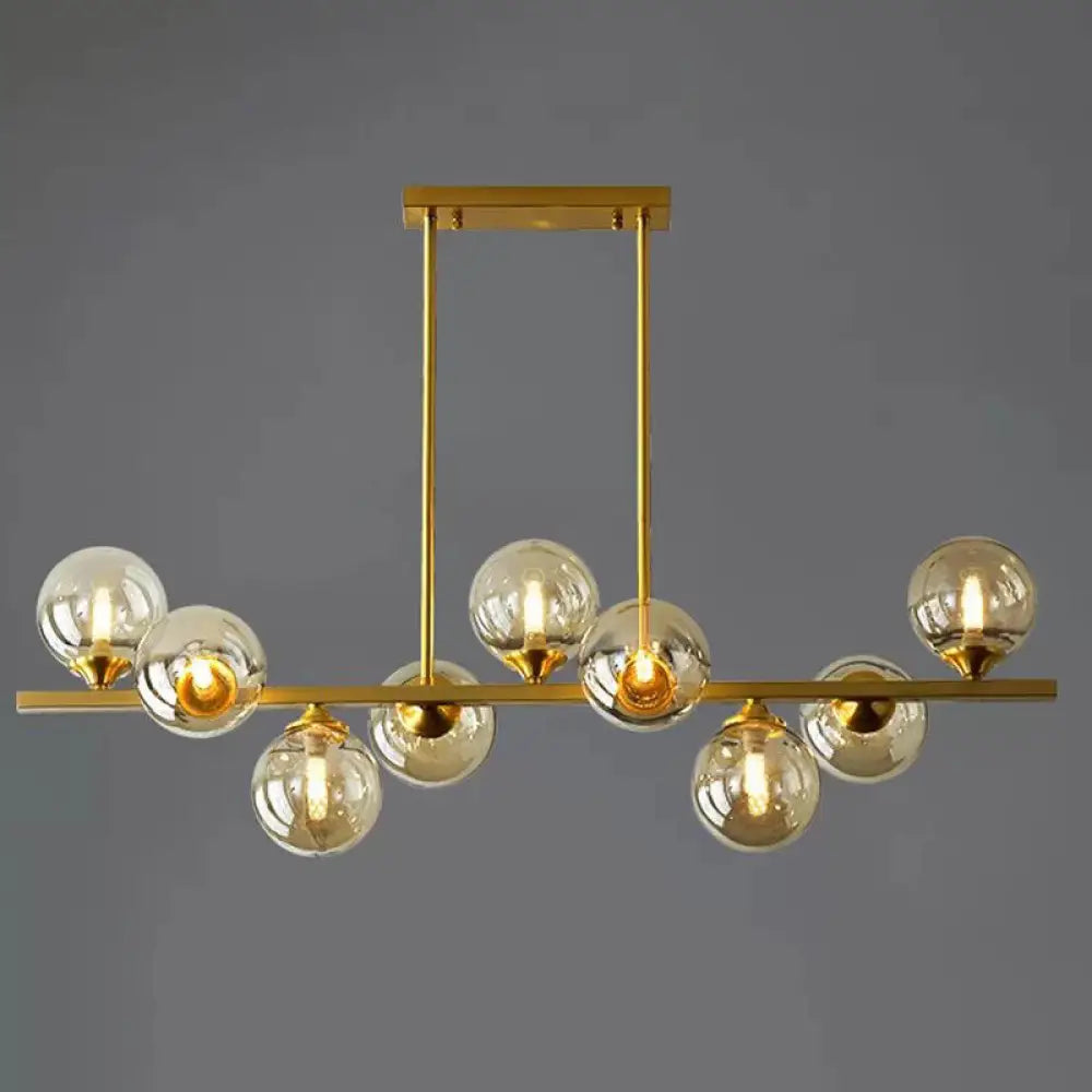 DecorBites™ Mid-Century Modern Gold Metal Pendant with Spherical Amber Glass - Island Ceiling Light for Dining Table