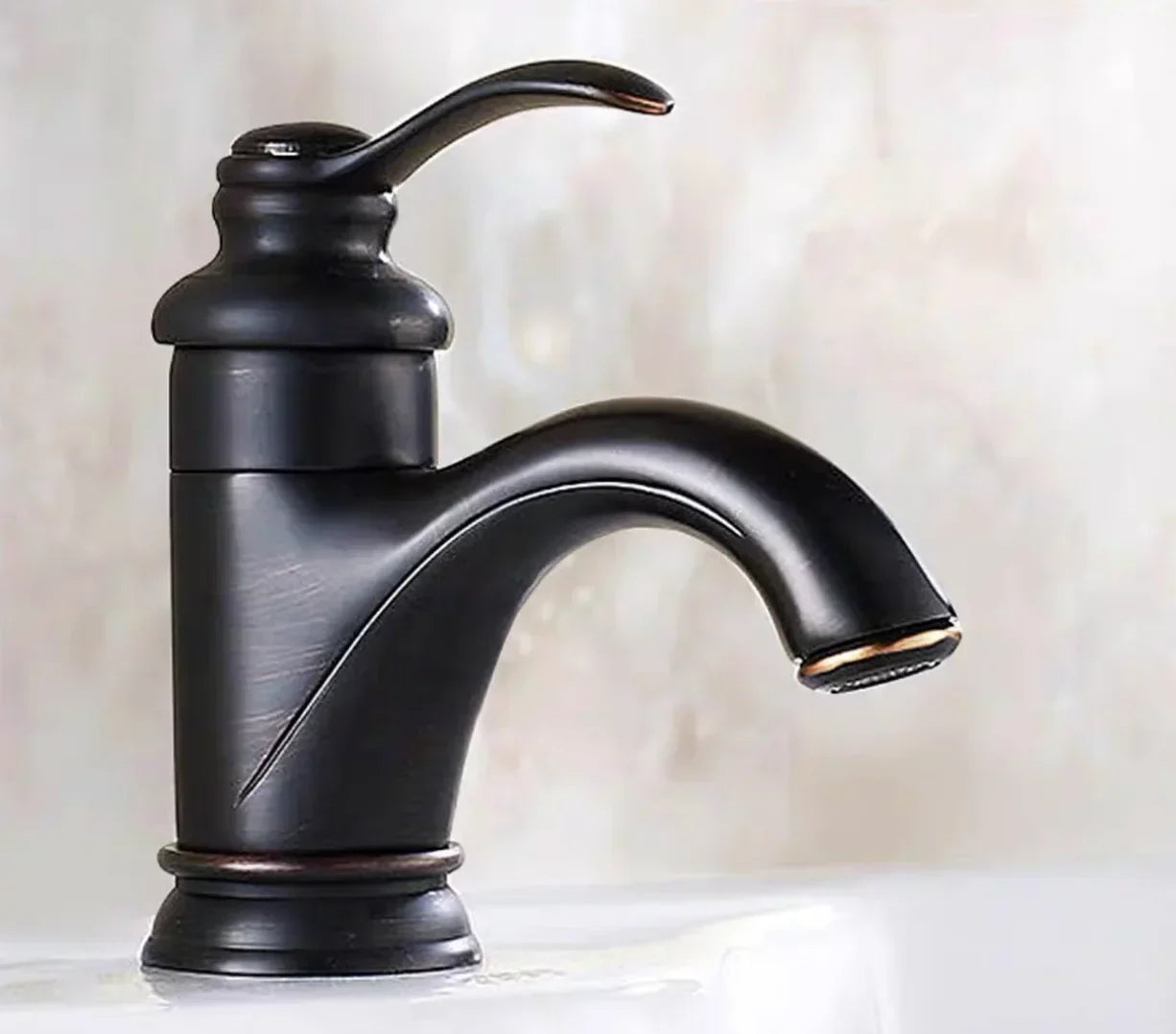 DecorBites™ Antique Brass Single Handle Deck Mount Bathroom Sink Faucet.