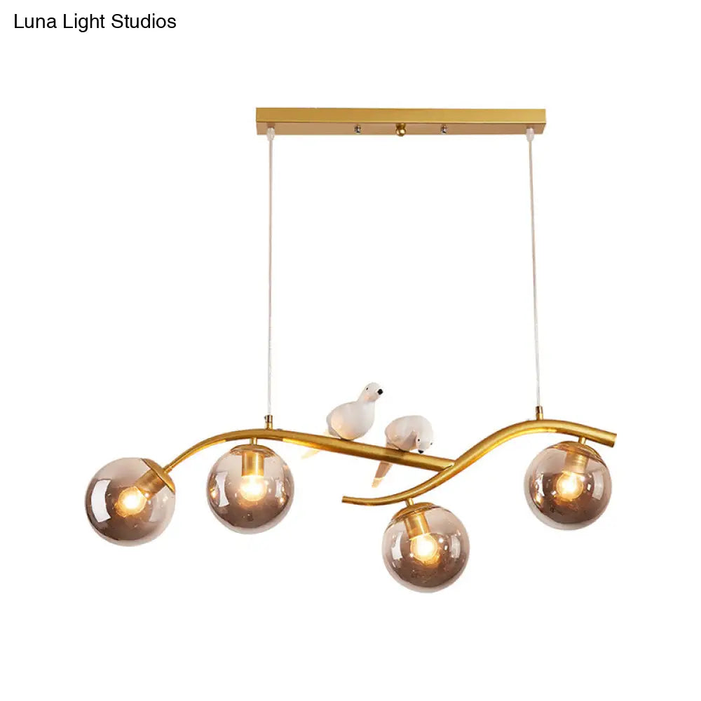 DecorBites™ Contemporary Metal Branch Hanging Lamp Island Pendant - 4-Light Black/Gold with Bird Deco and Smoke Grey/Cognac Glass Shade