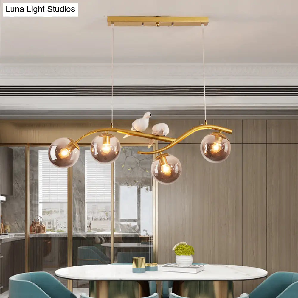 DecorBites™ Contemporary Metal Branch Hanging Lamp Island Pendant - 4-Light Black/Gold with Bird Deco and Smoke Grey/Cognac Glass Shade