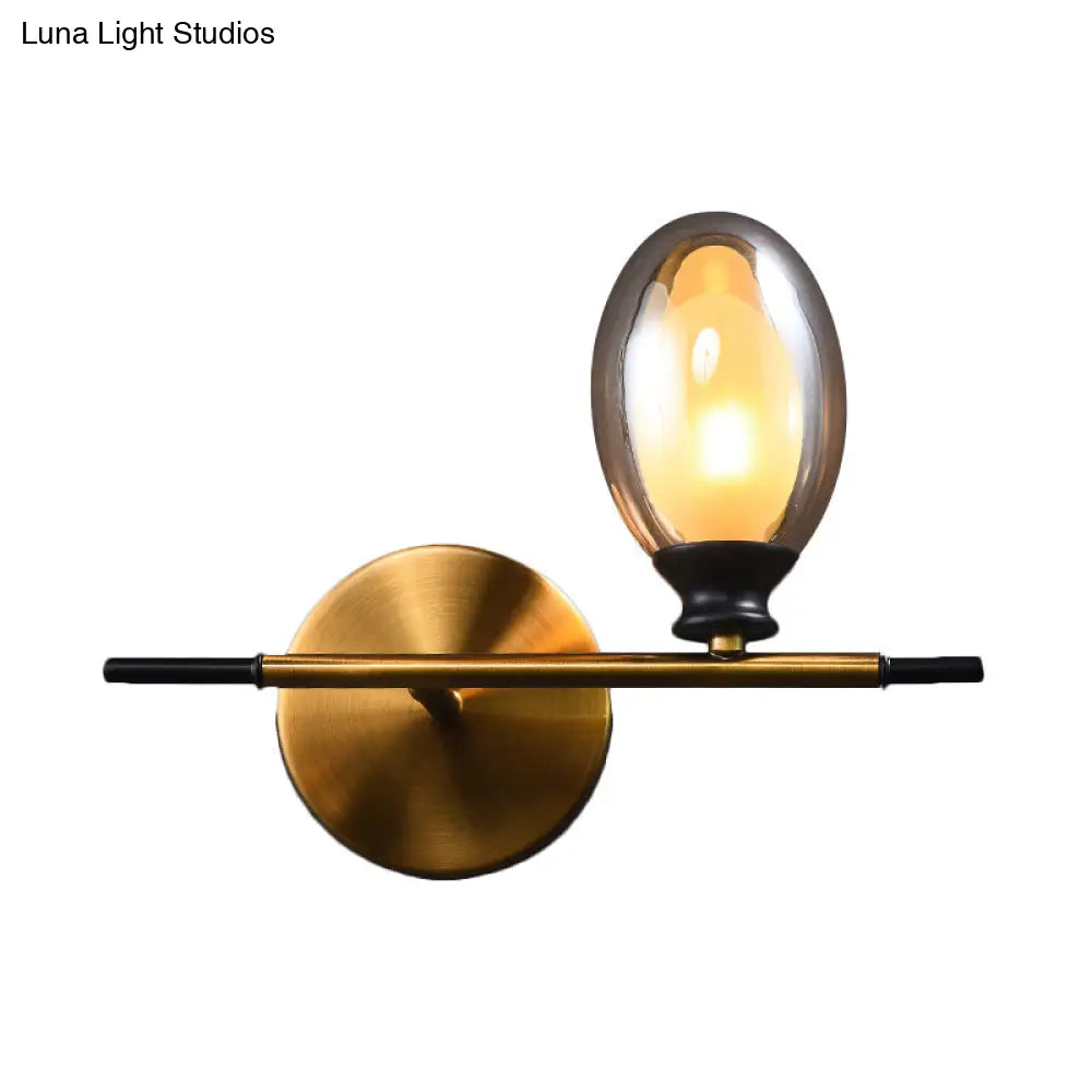 DecorBites™ Mid Century Brass Wall Lamp with Dual Oval Clear/Amber Glass Shade