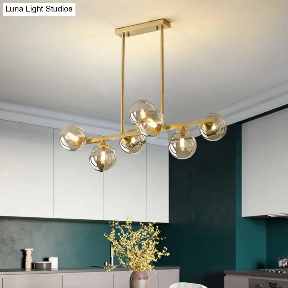 DecorBites™ Mid-Century Modern Gold Metal Pendant with Spherical Amber Glass - Island Ceiling Light for Dining Table
