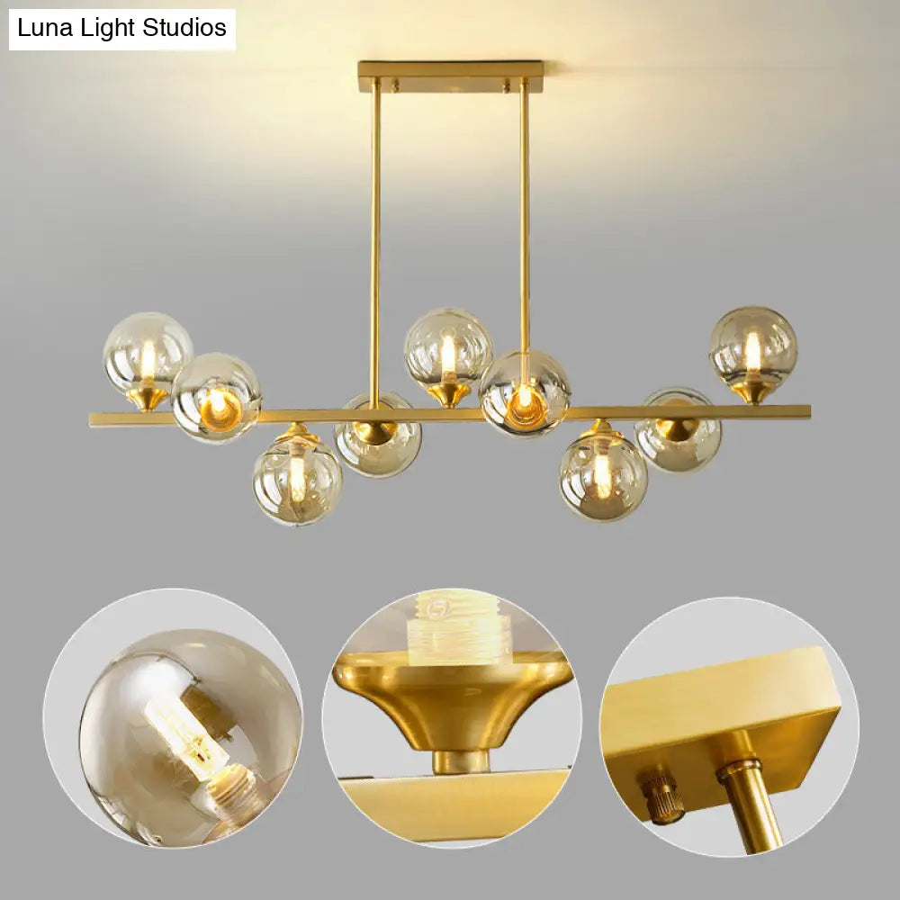 DecorBites™ Mid-Century Modern Gold Metal Pendant with Spherical Amber Glass - Island Ceiling Light for Dining Table