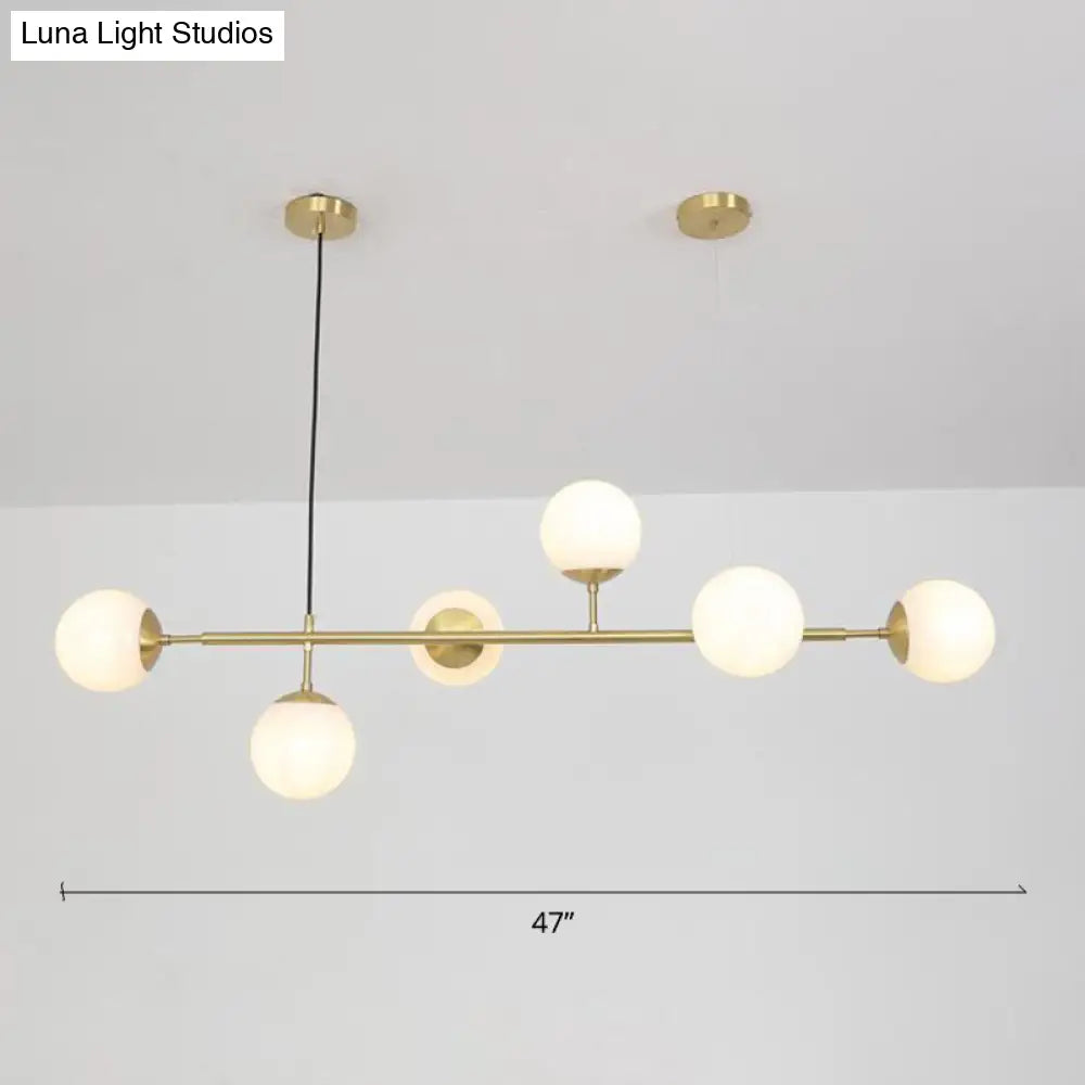 DecorBites™ Minimalist Brass Ball Island Lamp: 6-Bulb Suspension Light with Glass Shade - Perfect for Restaurants