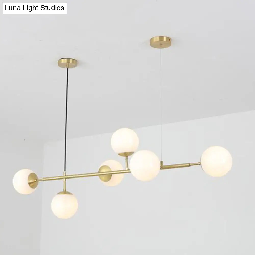 DecorBites™ Minimalist Brass Ball Island Lamp: 6-Bulb Suspension Light with Glass Shade - Perfect for Restaurants