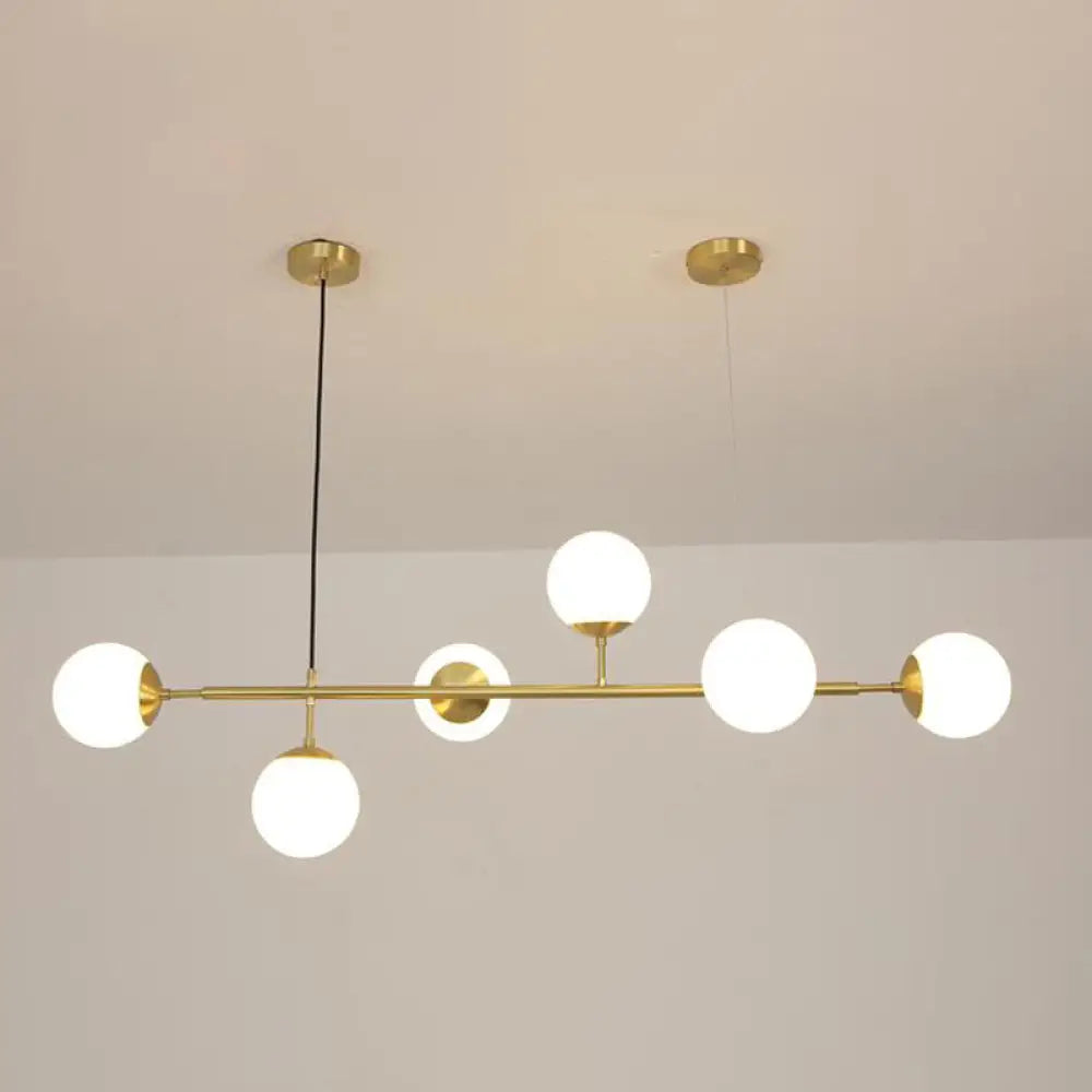 DecorBites™ Minimalist Brass Ball Island Lamp: 6-Bulb Suspension Light with Glass Shade - Perfect for Restaurants
