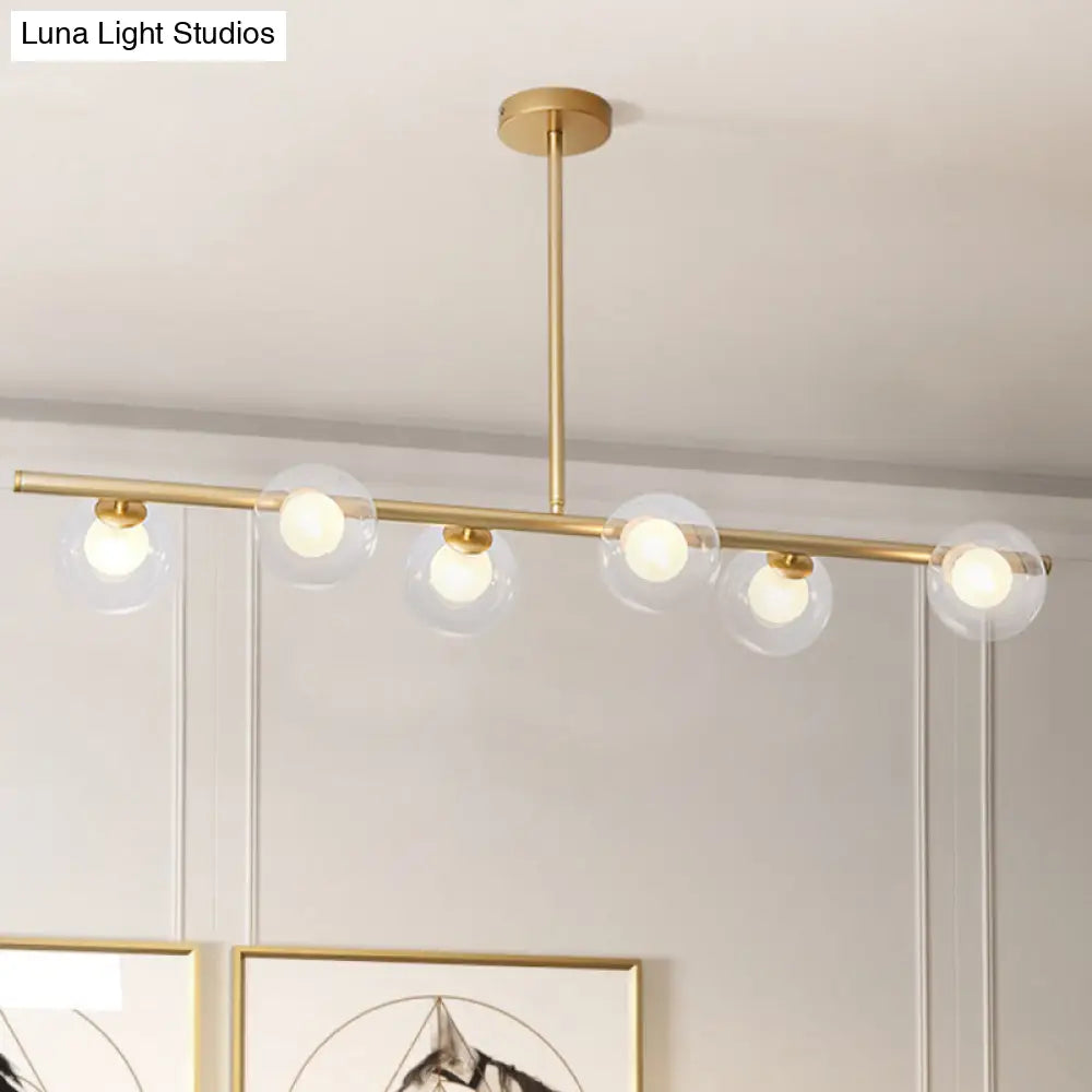 DecorBites™ Nordic Metal 6-Head Linear Island Light with Gold Finish and Clear Glass Globes